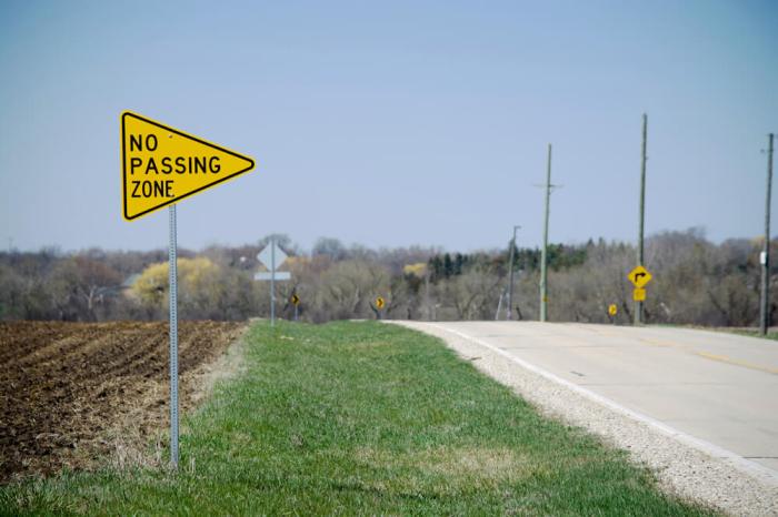 Passing sign crossing