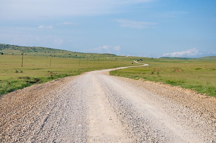 When a paved road intersects an unpaved road